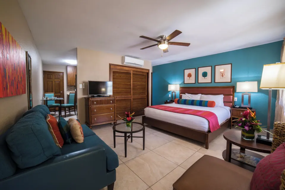 Deluxe studio with king bed, sofa and kitchenette at Simpson Bay Resort, Marina & Spa.