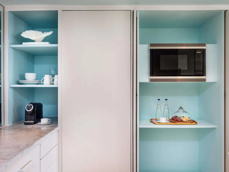 Ocean View Two Bedroom Residence kitchenette shelving and microwave at SLS Baha Mar.