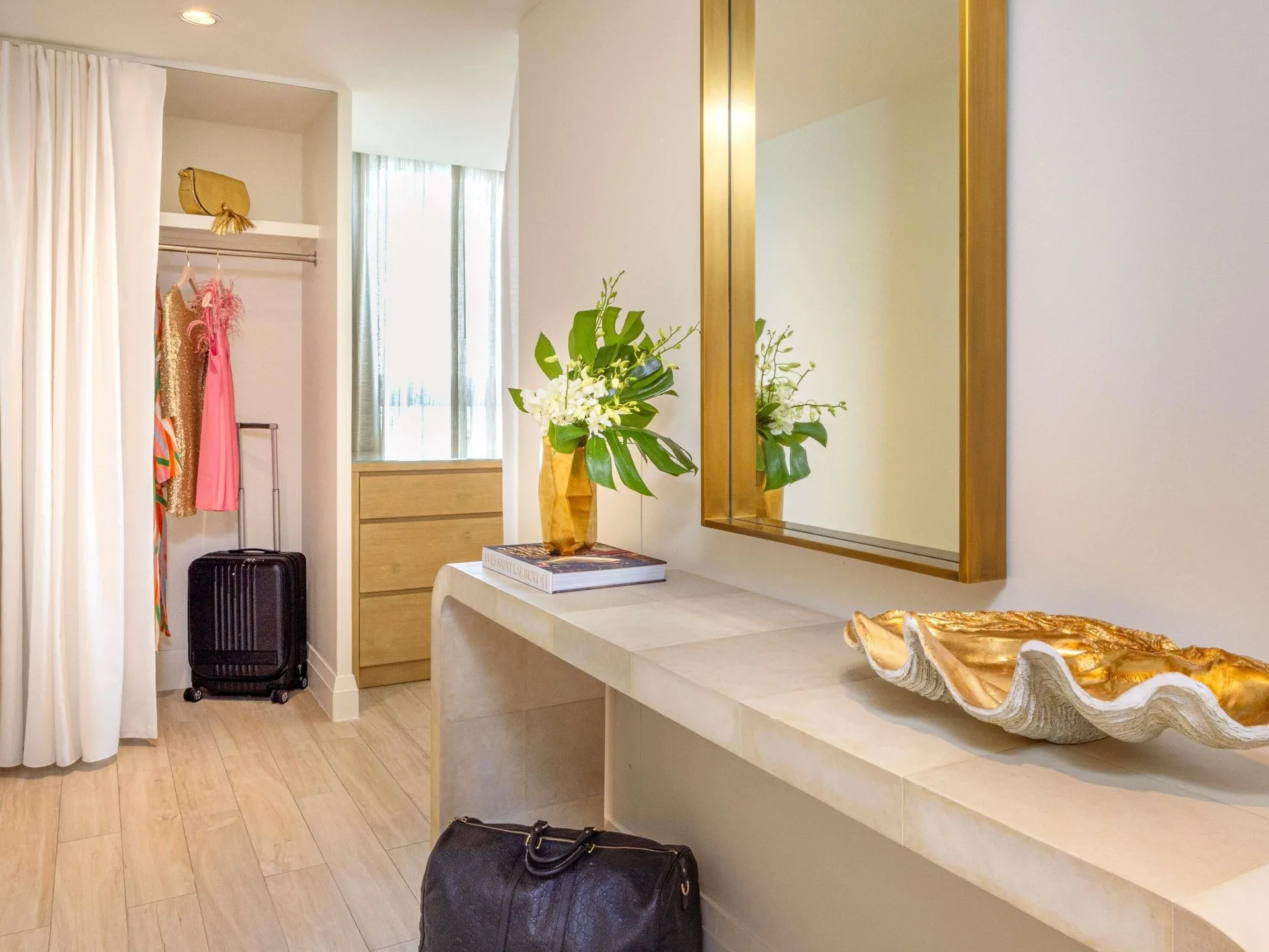 Dressing area with closet and mirror in a Three Bedroom SLS Baha Mar at SLS Baha Mar.