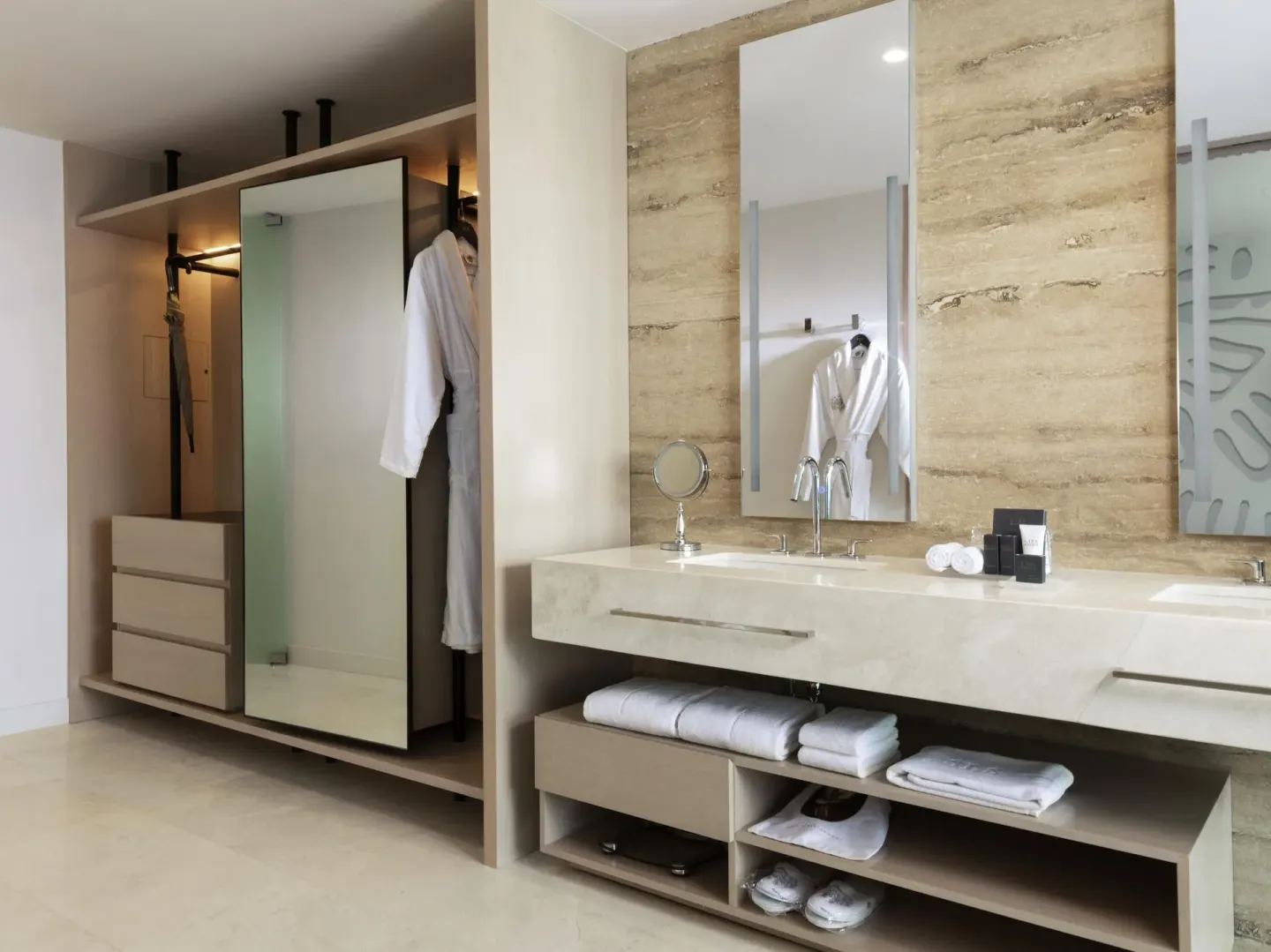 Deluxe Room Oceanfront at SLS Cancun bathroom with double vanity, mirrors and open wardrobe.