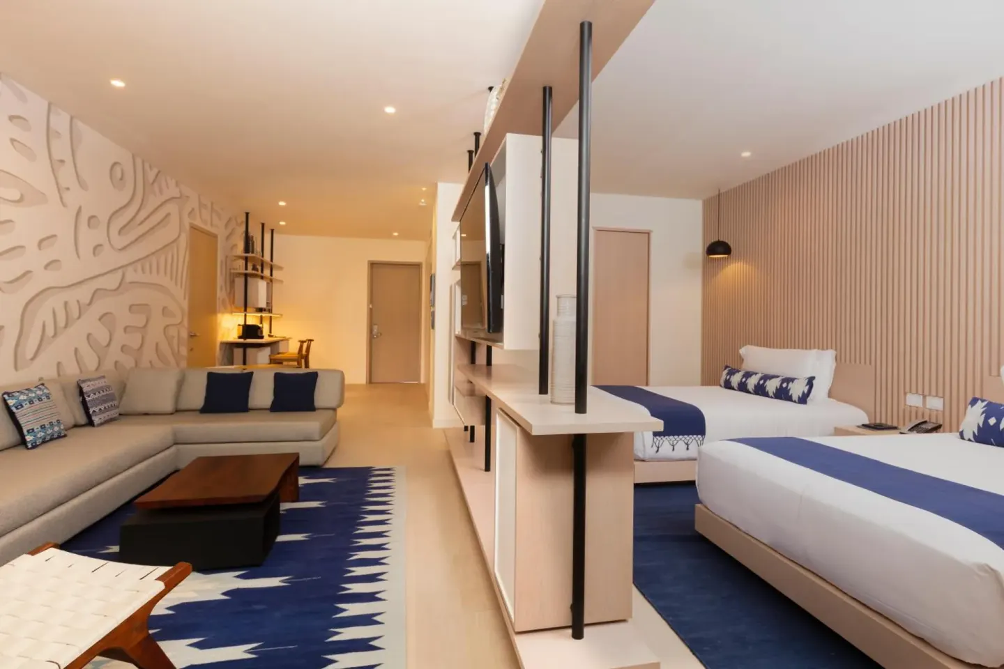 Superior Street View room with two beds and a lounge area at SLS Cancun.