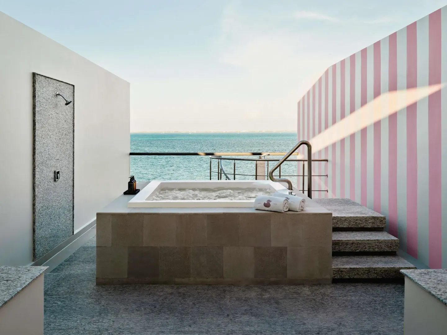 Private terrace hot tub with ocean view at SLS Playa Mujeres.