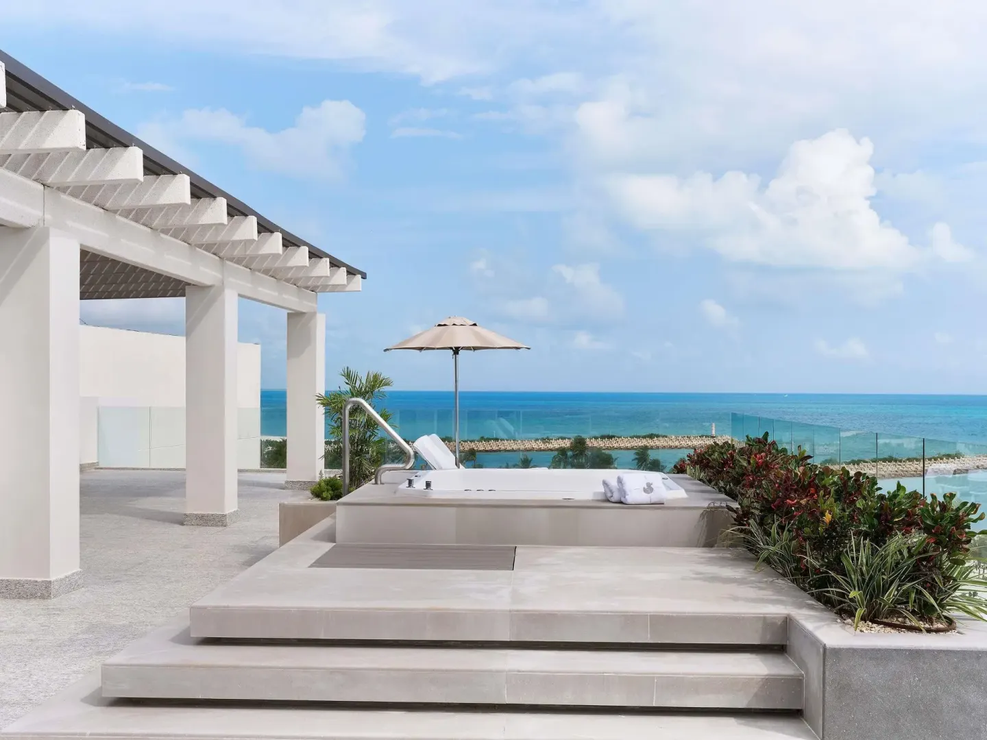 Rooftop terrace plunge pool with ocean view at SLS Playa Mujeres.