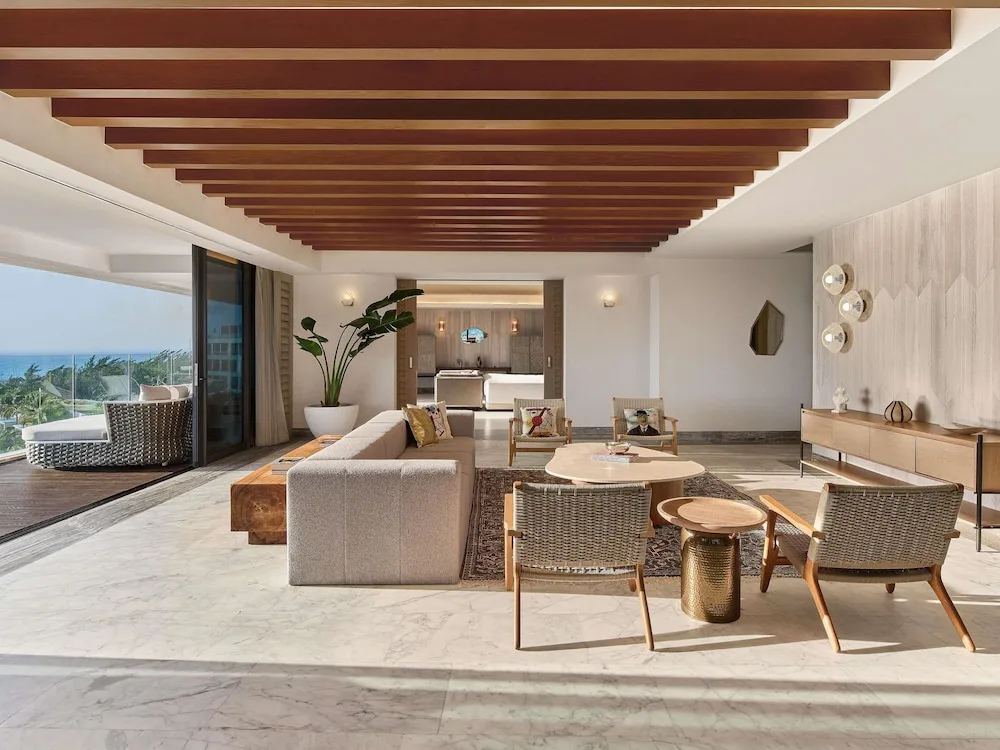 Suite living room with terrace and ocean view at SLS Playa Mujeres.