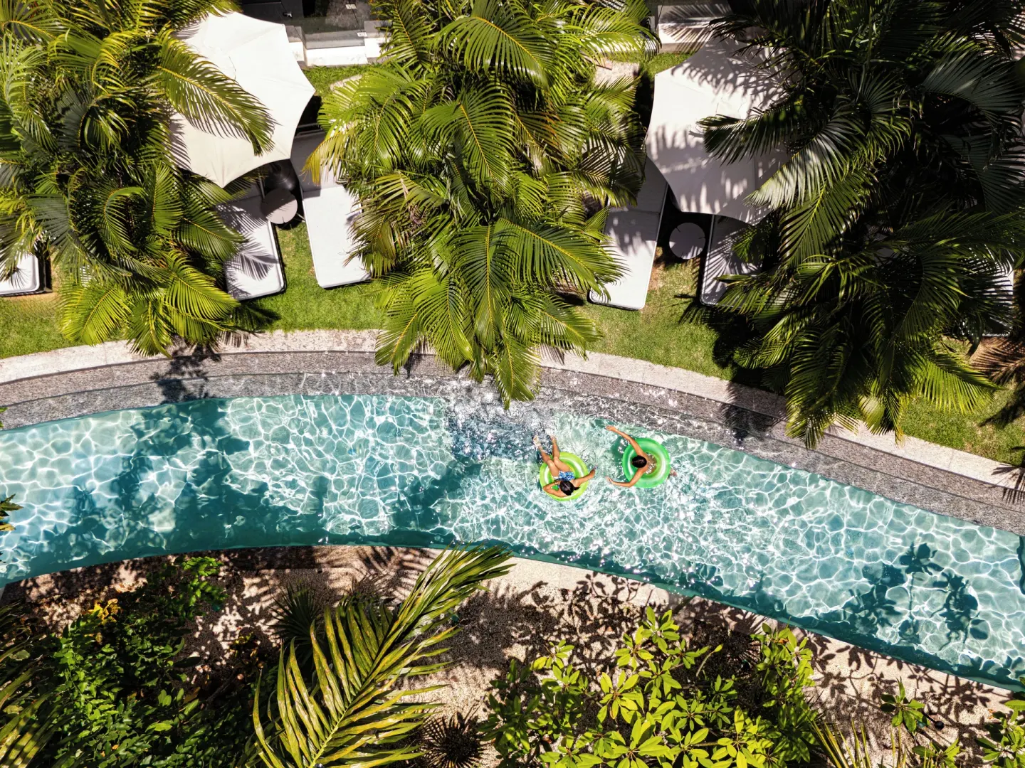 Aerial view of the Captivate Swim-Out pool and loungers at SLS Playa Mujeres.