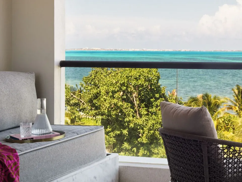 Delight Ocean View balcony daybed overlooking the sea at SLS Playa Mujeres.