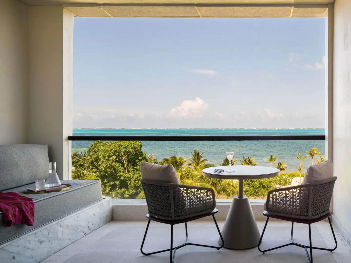 Delight Ocean View terrace seating with ocean backdrop at SLS Playa Mujeres.