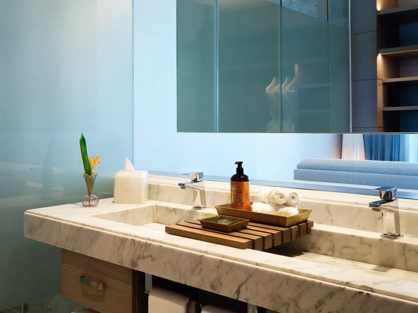 Delight guest room marble bathroom vanity with amenities at SLS Playa Mujeres.