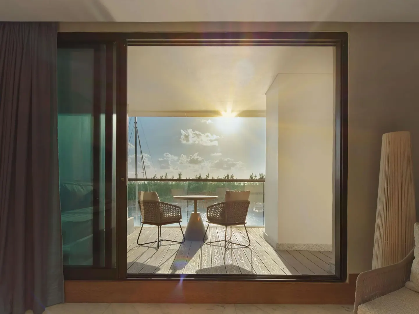 Euphoria Corner Suite Marina View balcony at sunset from inside SLS Playa Mujeres.