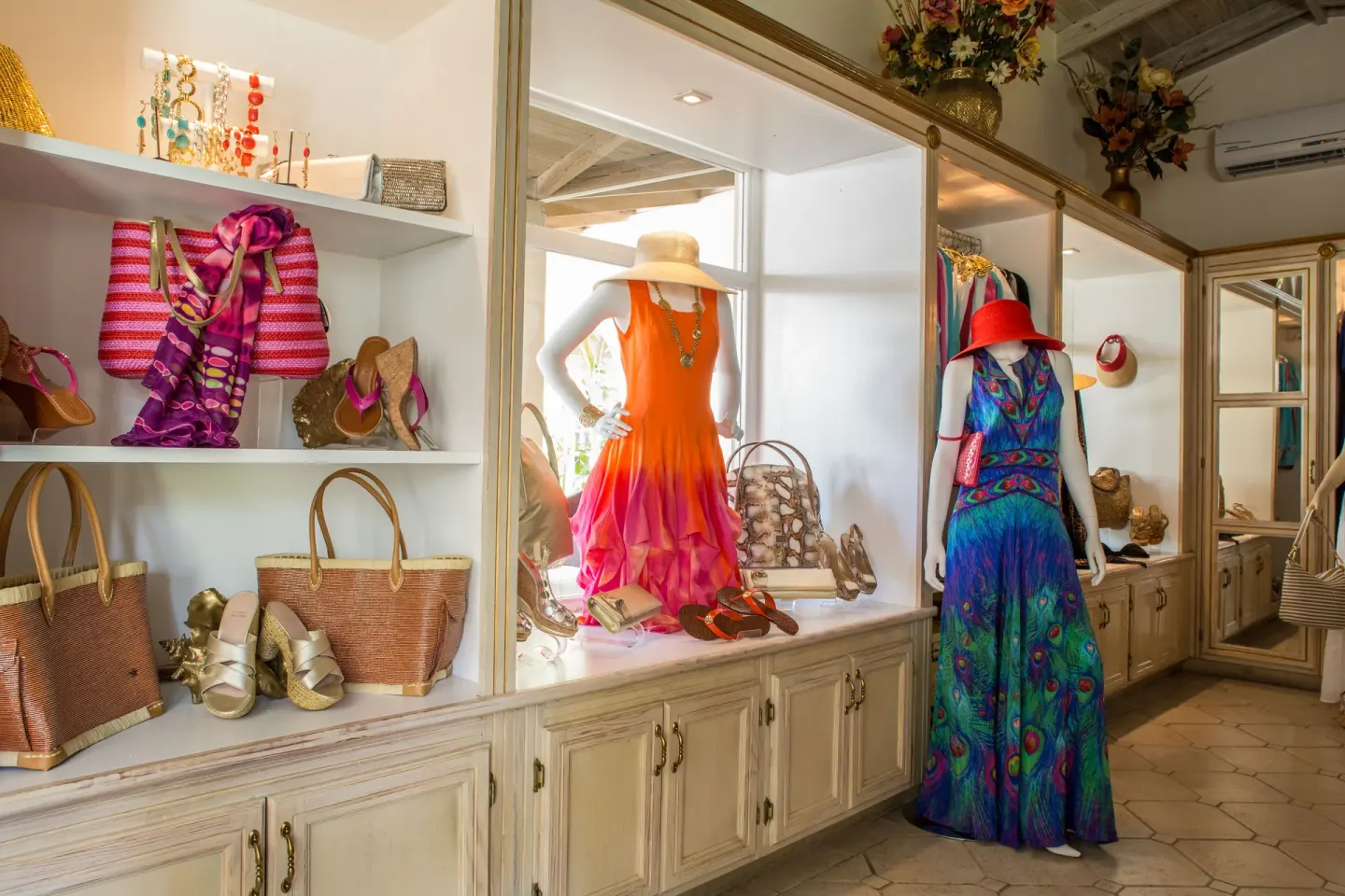 Boutique display of dresses, handbags, and accessories at Spice Island Beach Resort.