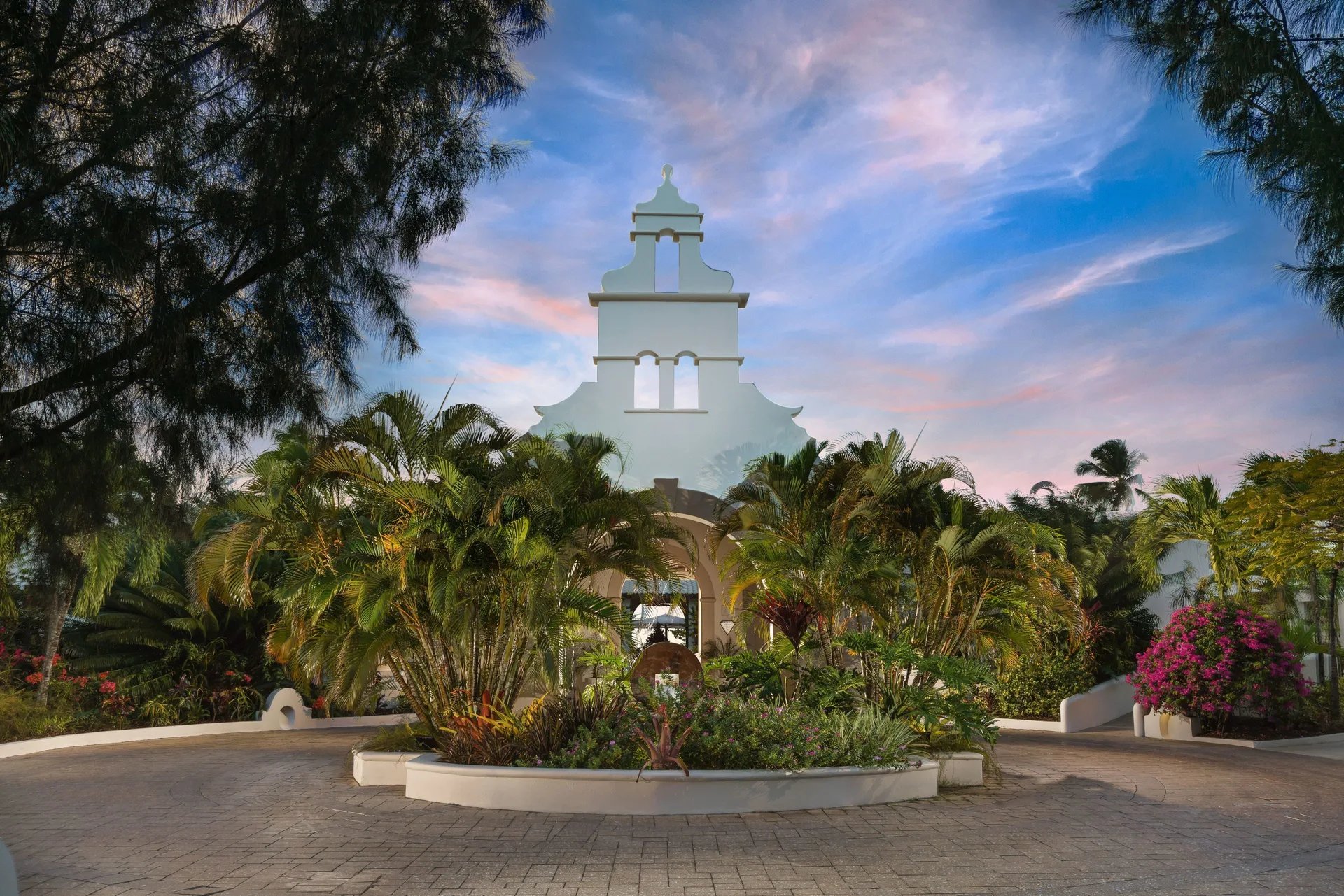 Illuminated garden entrance at dusk at Spice Island Beach Resort.