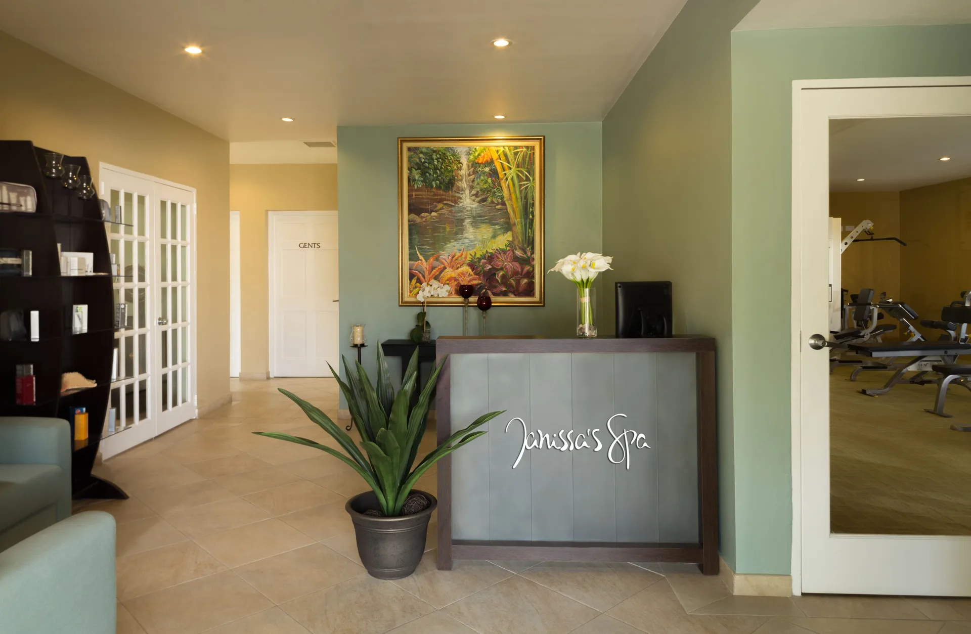 Janissa’s Spa reception desk and adjacent fitness room at Spice Island Beach Resort.