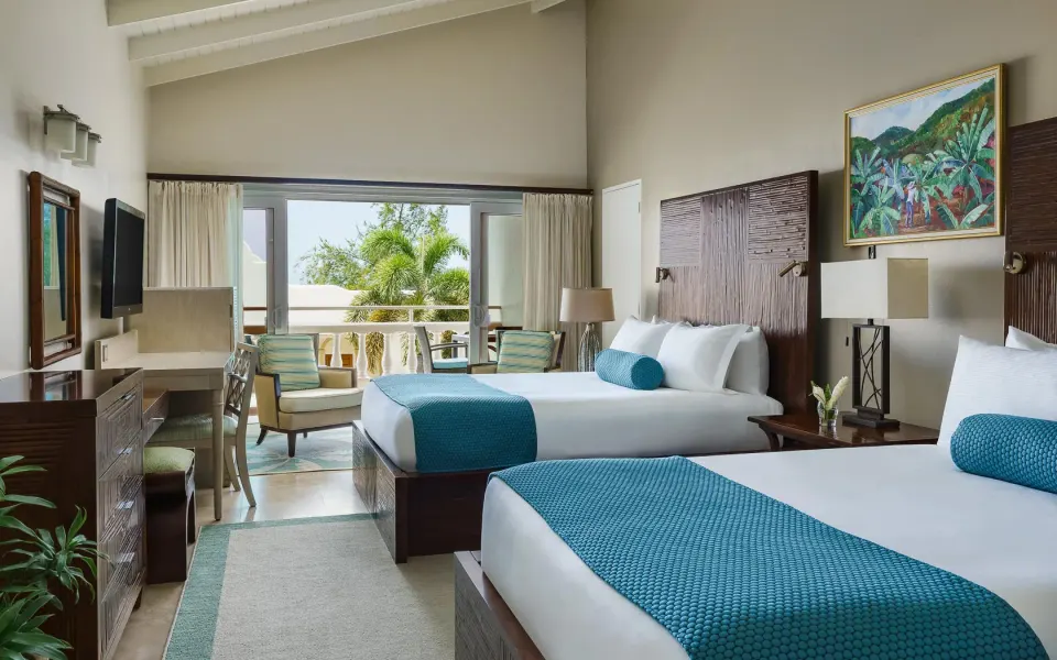 Inside the Oleander Garden Suite at Spice Island Beach Resort — from the hotel's own gallery.