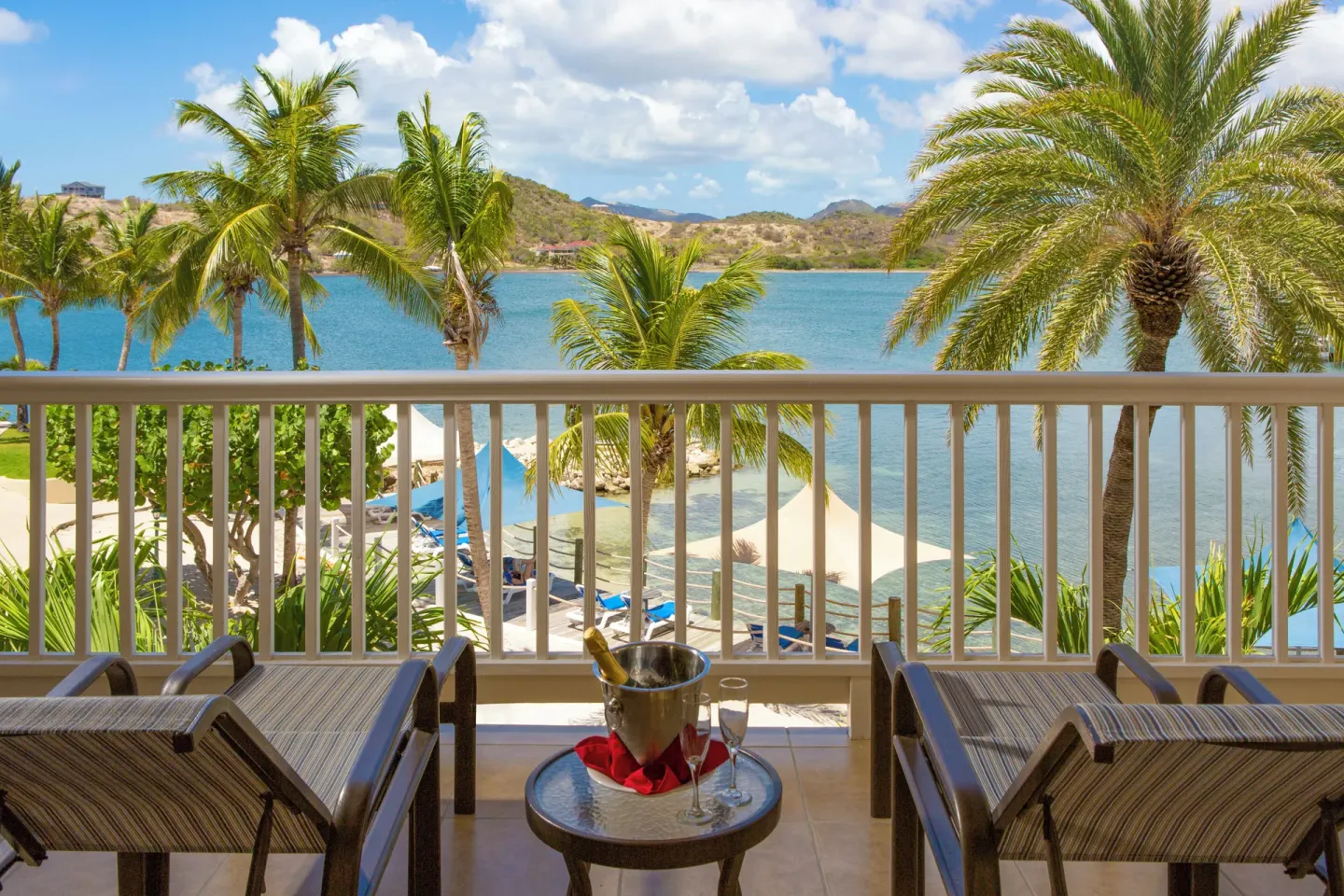 Balcony loungers with a champagne bucket and bay view at St. James's Club Antigua.