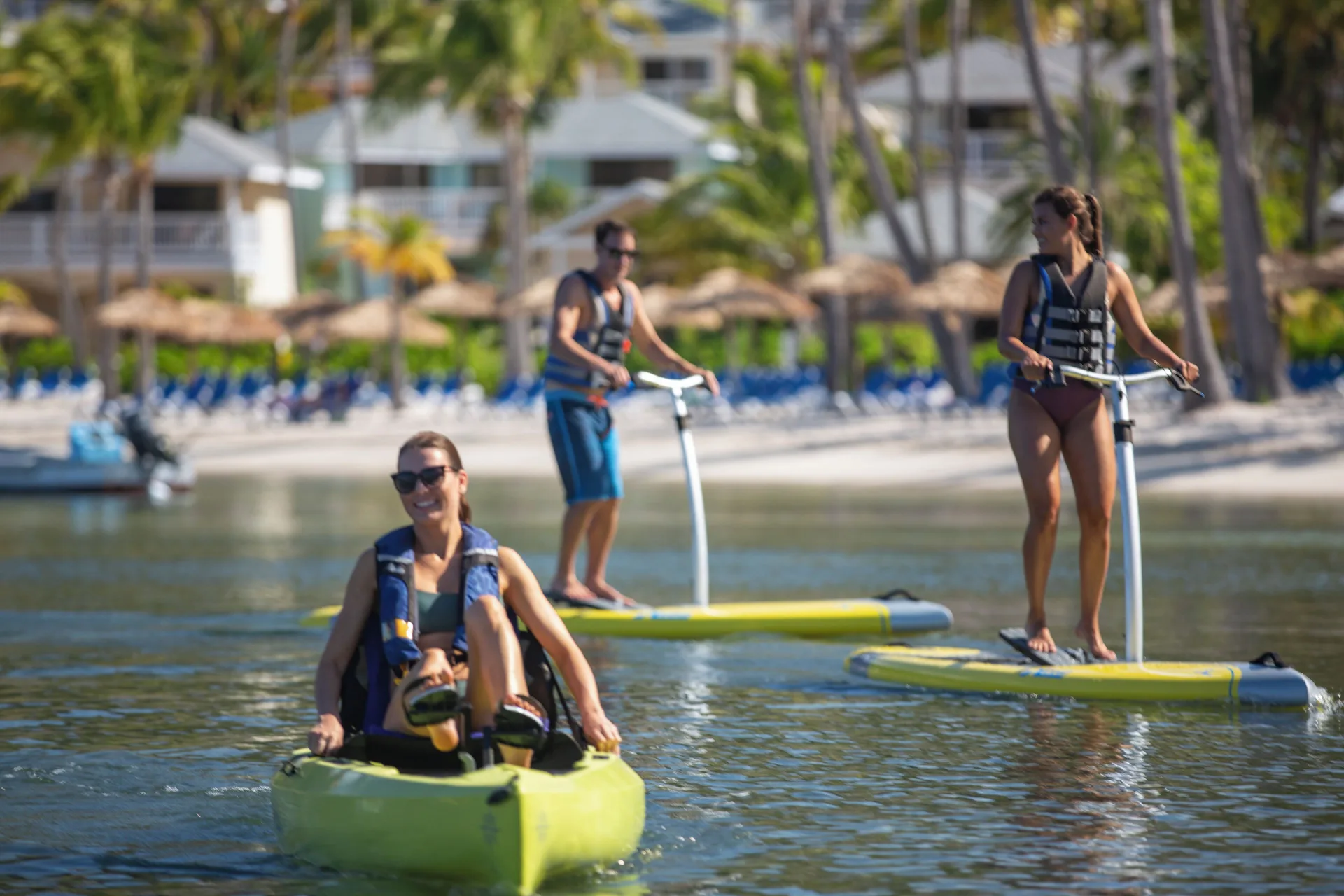 Guests kayaking and paddleboarding near the beach at St. James's Club Antigua.