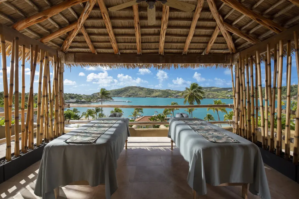 Open-air spa treatment beds overlooking Mamora Bay at St. James's Club Antigua.