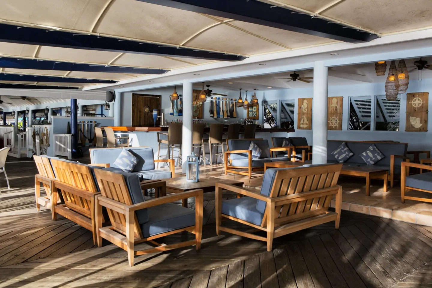 Covered lounge and bar seating area at St. James's Club Antigua.