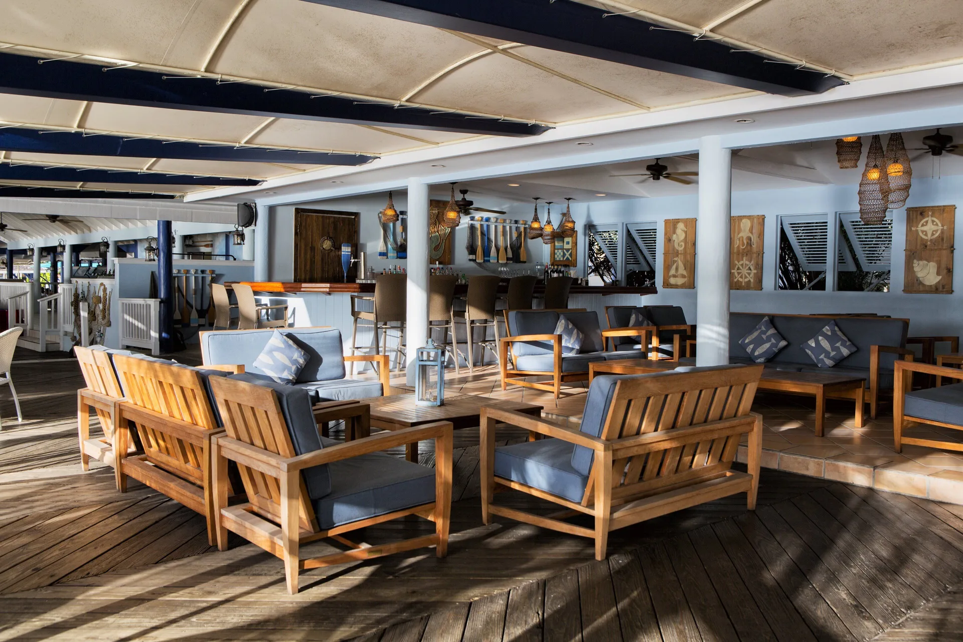 Covered lounge and bar seating area at St. James's Club Antigua.