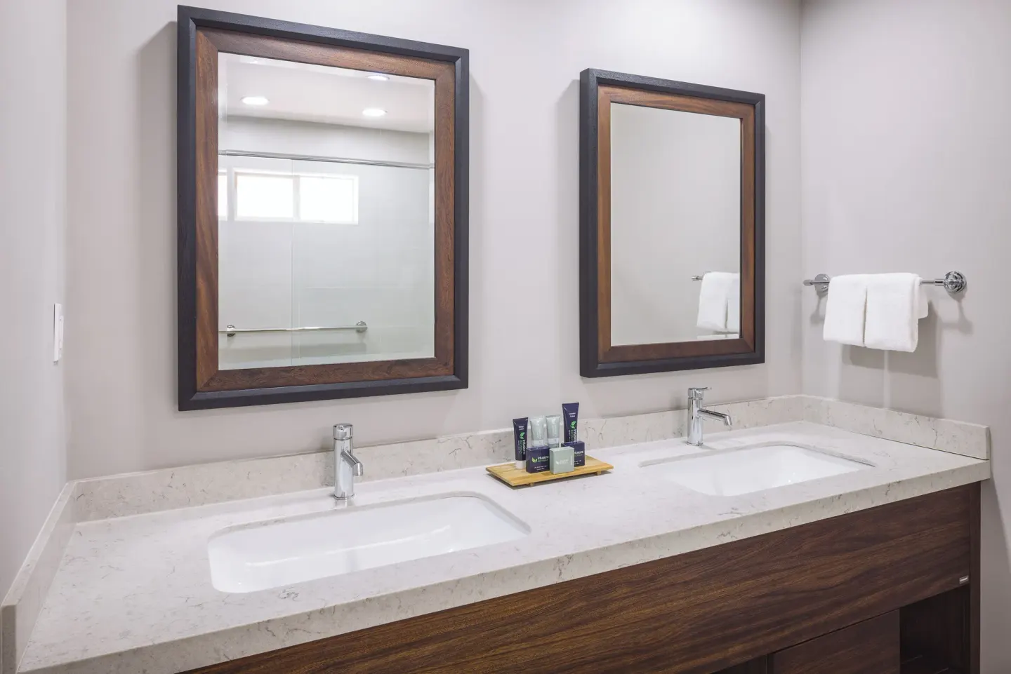 Beachfront Room bathroom with double vanity and mirrors at St. James's Club Antigua.