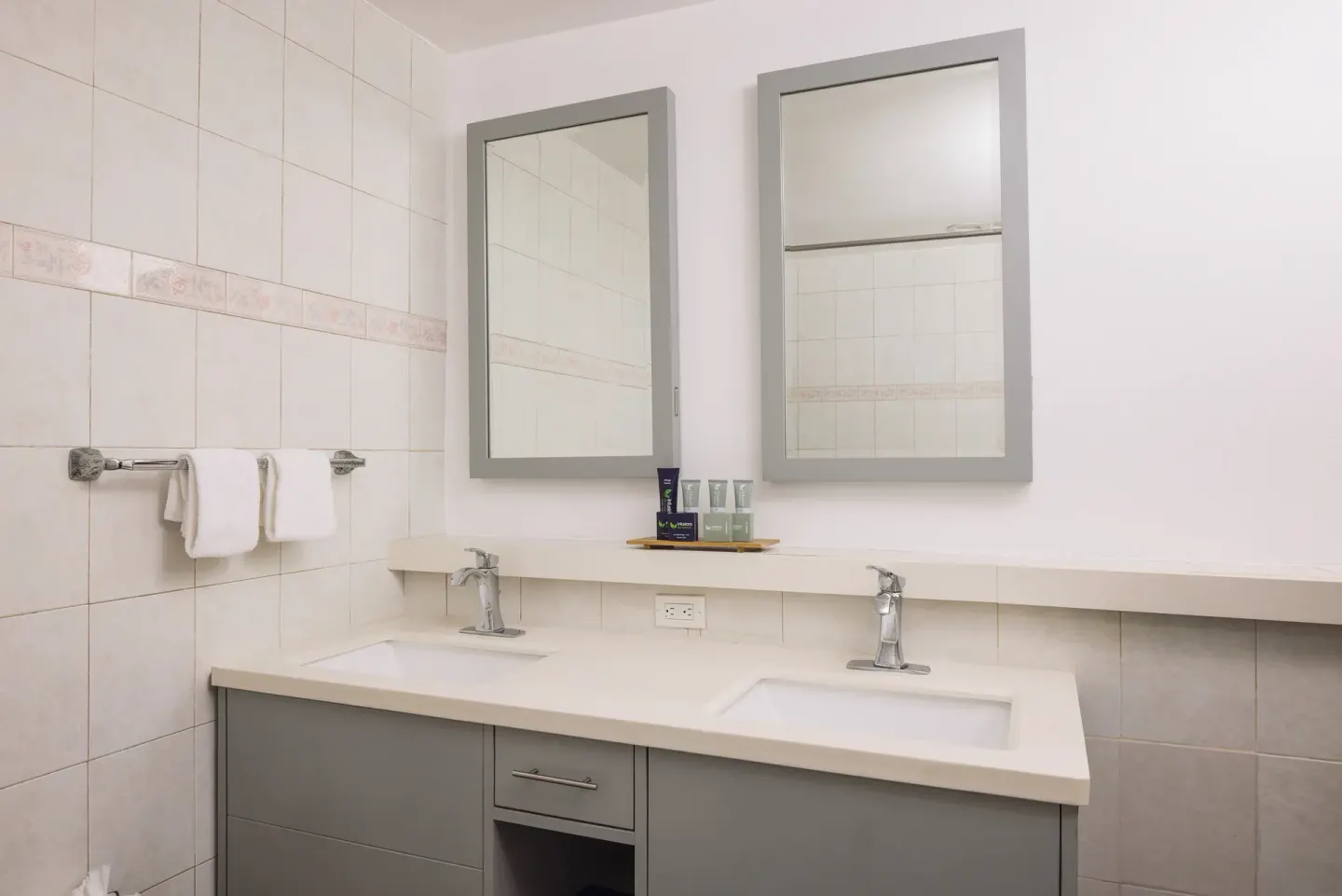 Club Room bathroom double vanity with mirrors at St. James's Club Antigua.