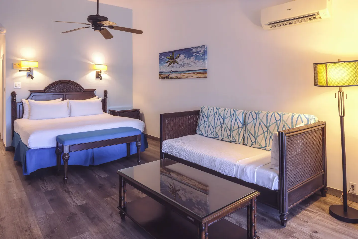 Junior Suite king bed and sofa seating at St. James's Club Antigua.