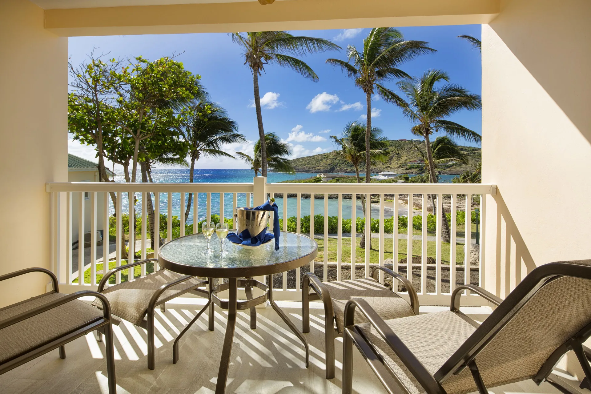 Junior Suite balcony with ocean view and seating at St. James's Club Antigua.