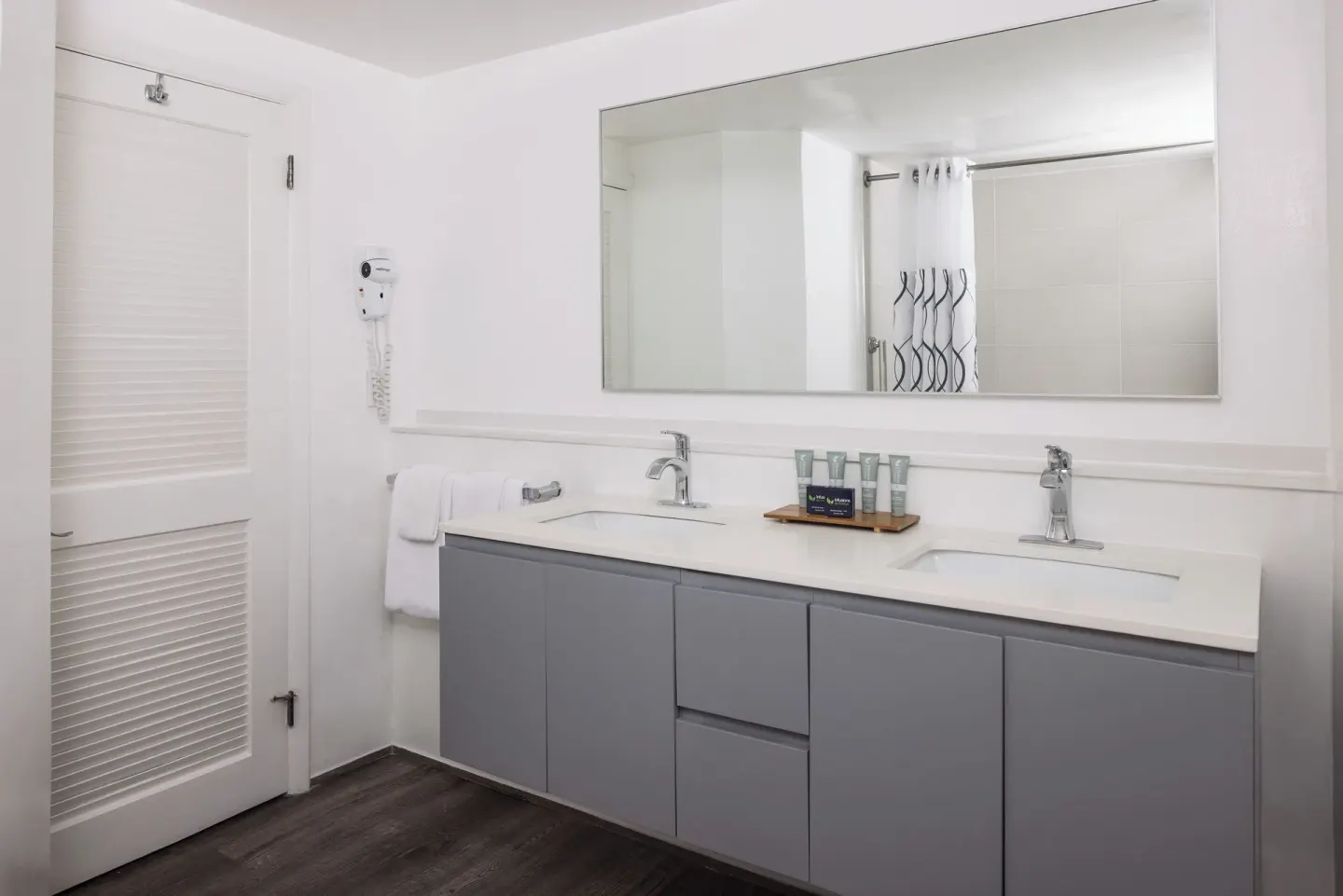 Premium Room bathroom with double vanity and large mirror at St. James's Club Antigua.