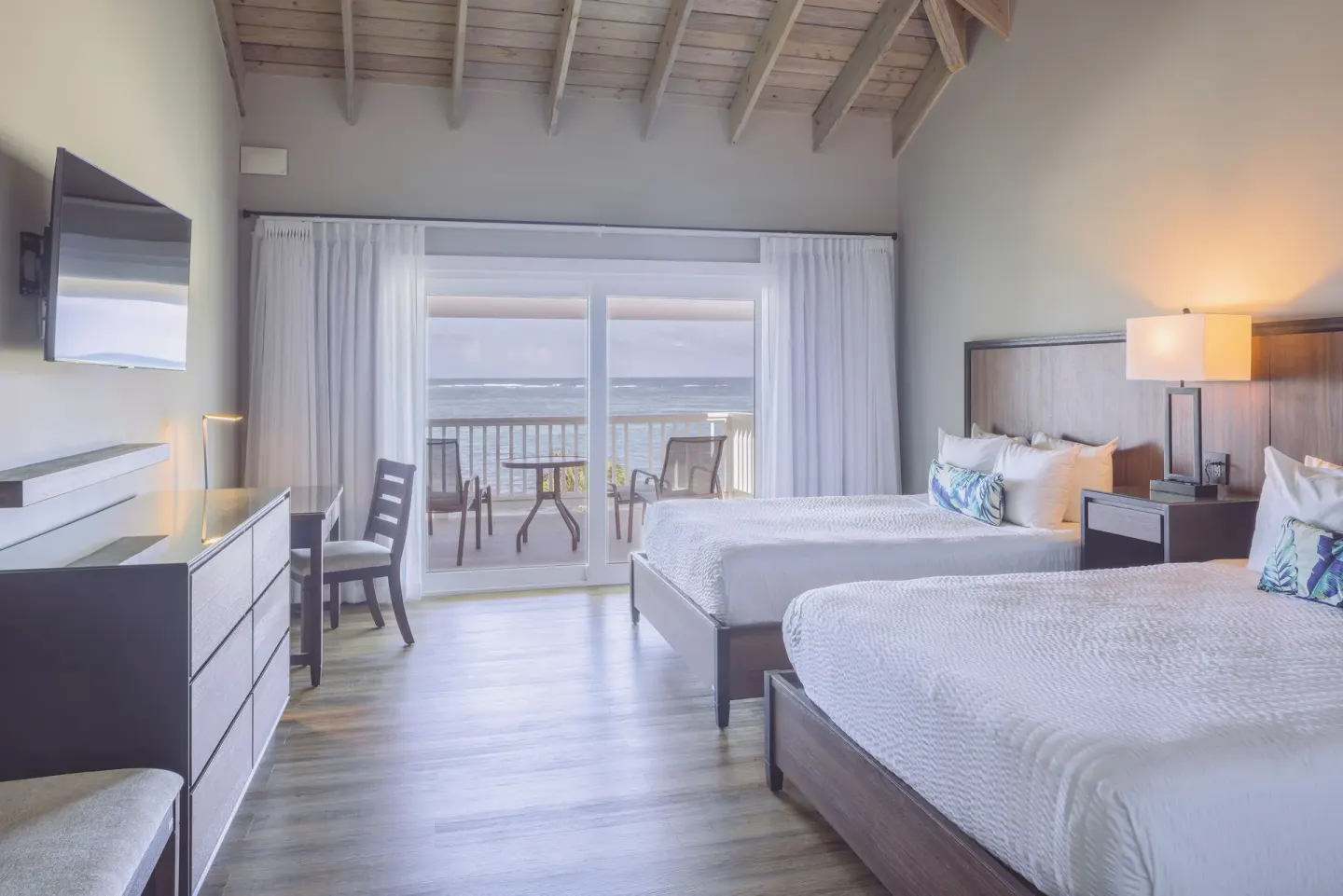 Beachfront room with two beds and ocean balcony at St. James's Club Antigua.
