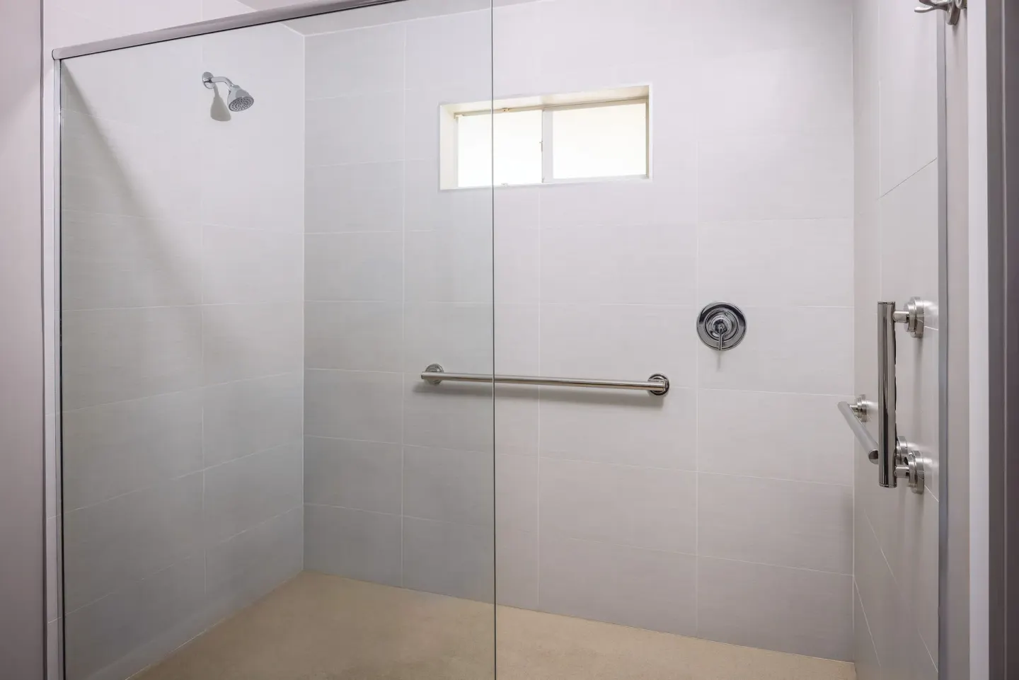 Glass-enclosed walk-in shower in a beachfront room at St. James's Club Antigua.