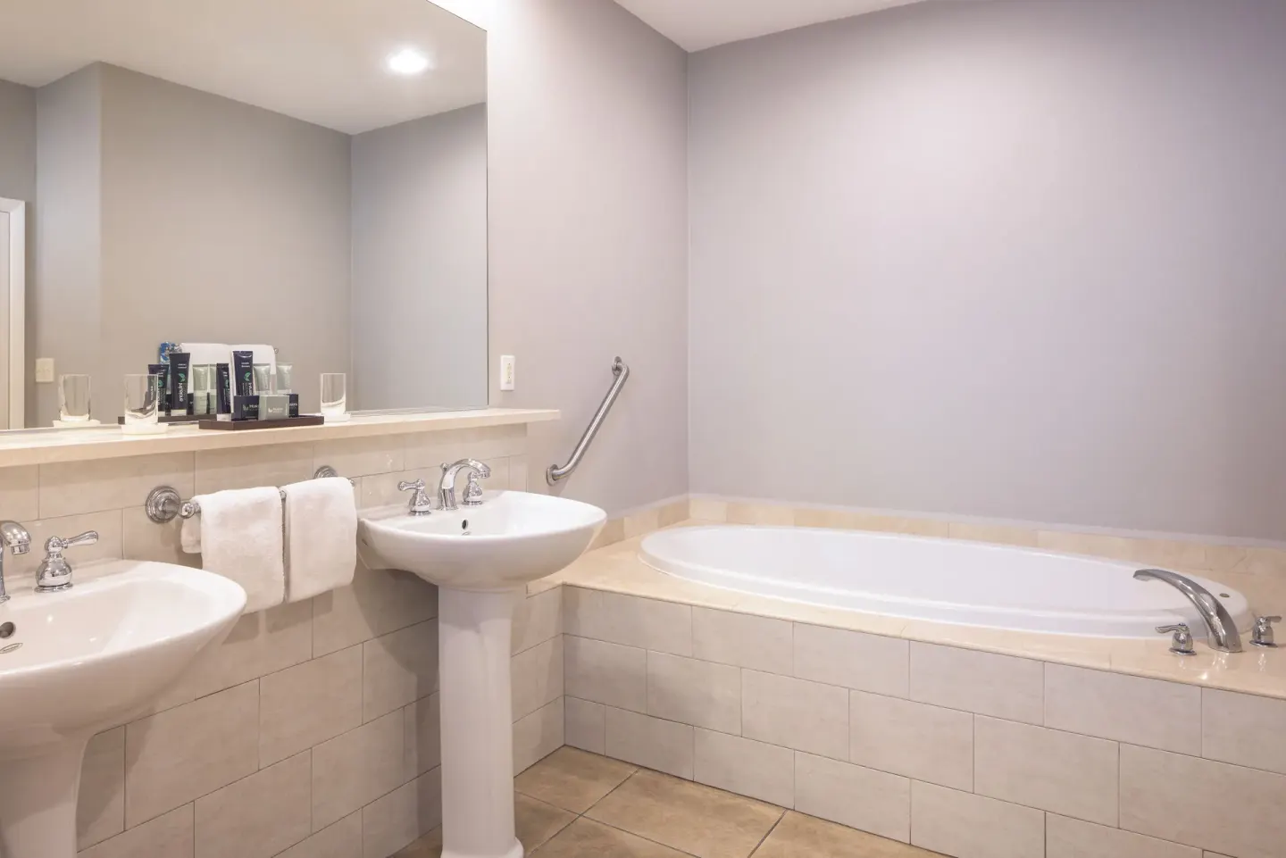 Royal Suite bathroom with twin sinks and soaking tub at St. James's Club Antigua.