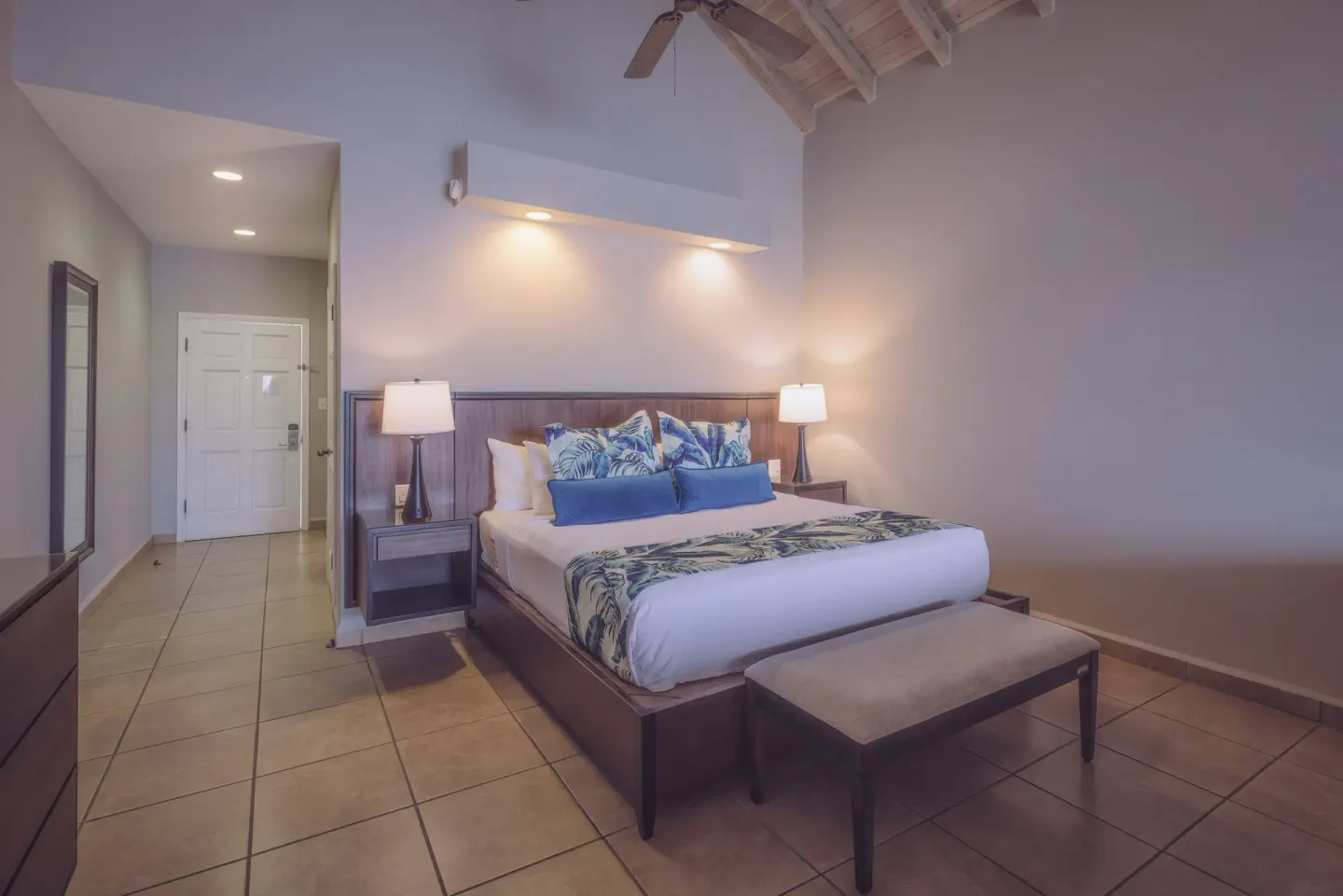 Royal Suite king bed beneath a vaulted ceiling at St. James's Club Antigua.