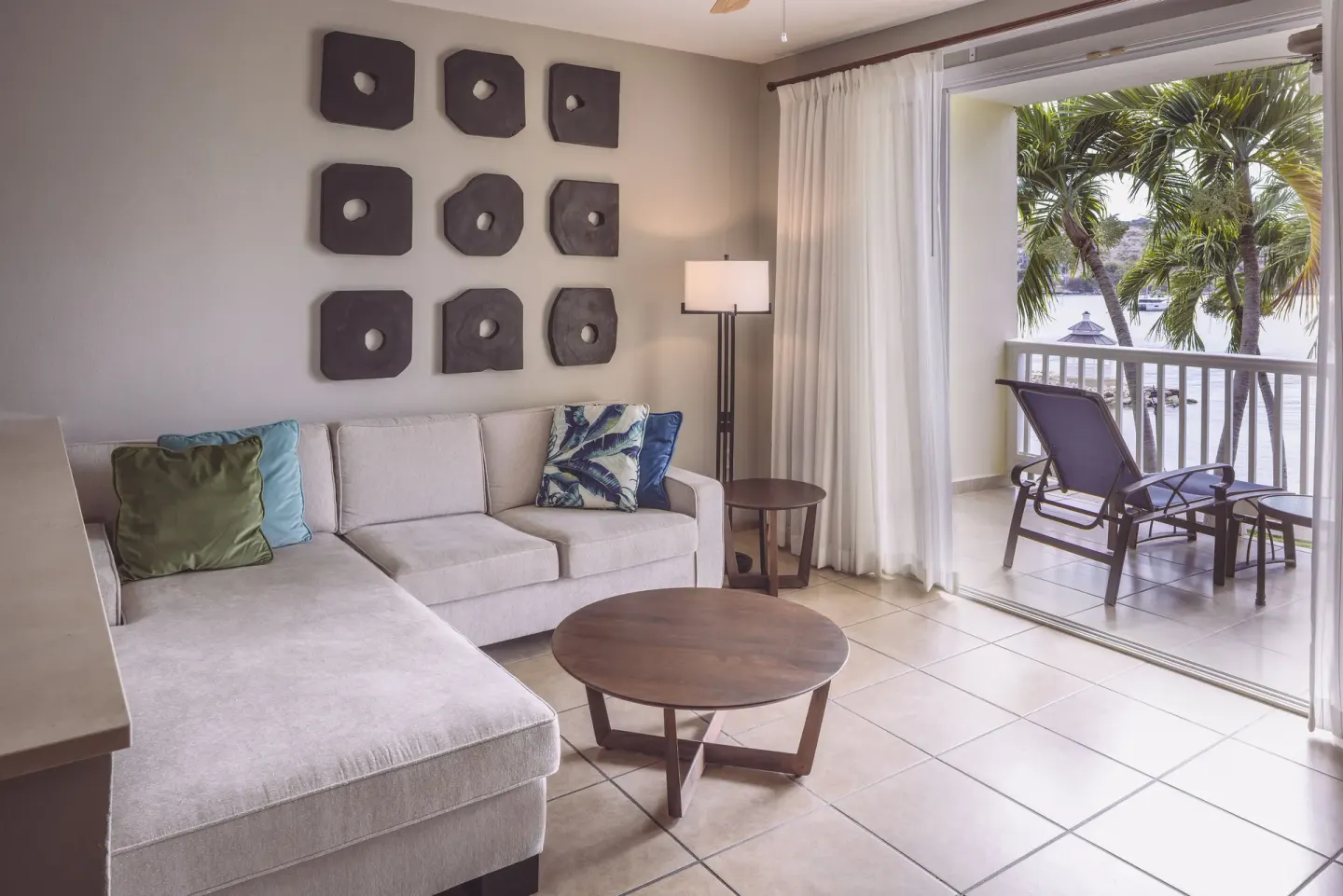 Royal Suite living area with sofa and balcony at St. James's Club Antigua.