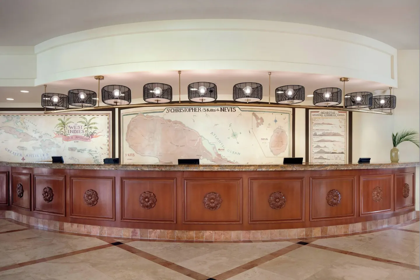 Front desk with island map artwork at St Kitts Marriott Beach Resort, Casino & Spa.
