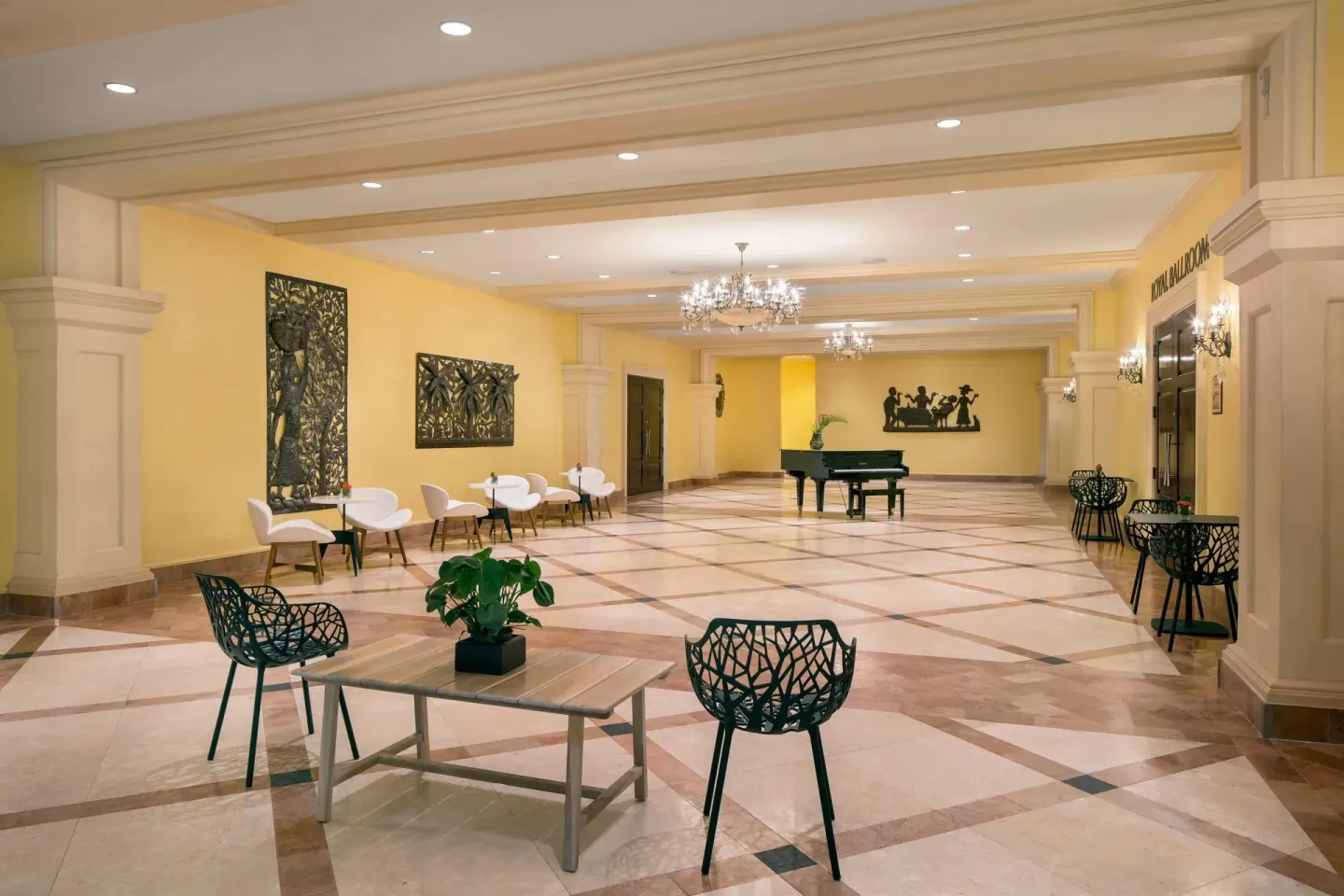 Lobby seating area with a piano and ballroom entrance at St Kitts Marriott Beach Resort, Casino & Spa.