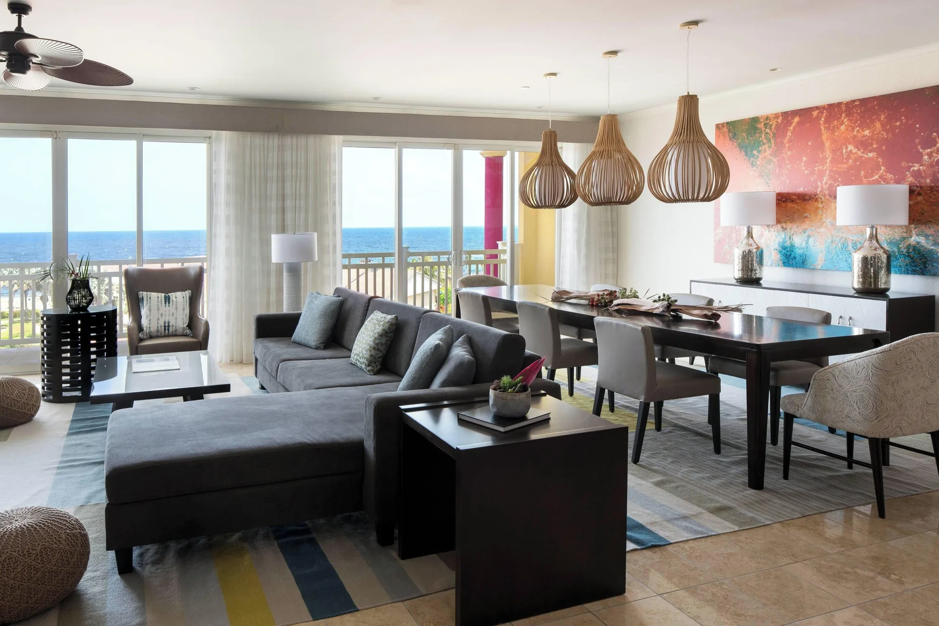 Suite living and dining area with ocean-facing windows at St Kitts Marriott Beach Resort, Casino & Spa.