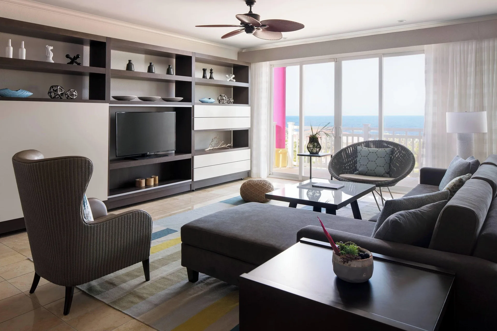 Ocean-view suite living room with balcony at St Kitts Marriott Beach Resort, Casino & Spa.