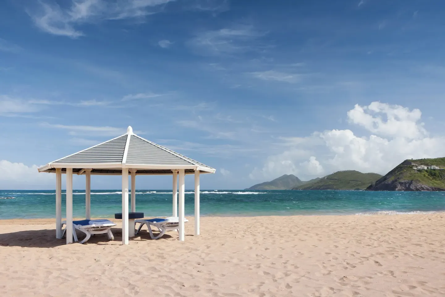 Single beach cabana with lounge chairs at St Kitts Marriott Beach Resort, Casino & Spa.