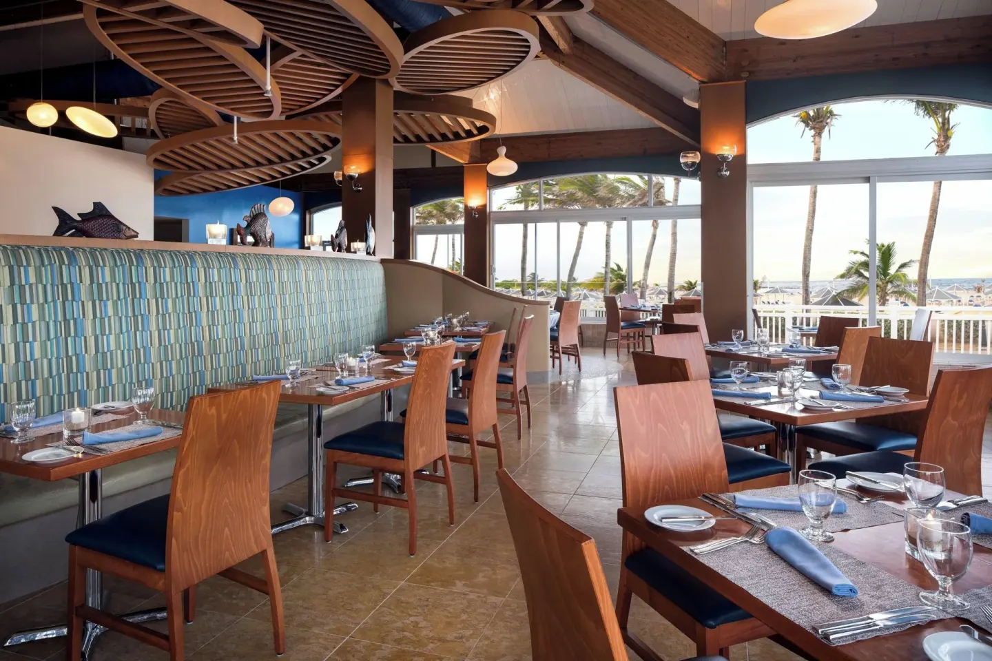 Ocean-view dining room with set tables at St Kitts Marriott Beach Resort, Casino & Spa.