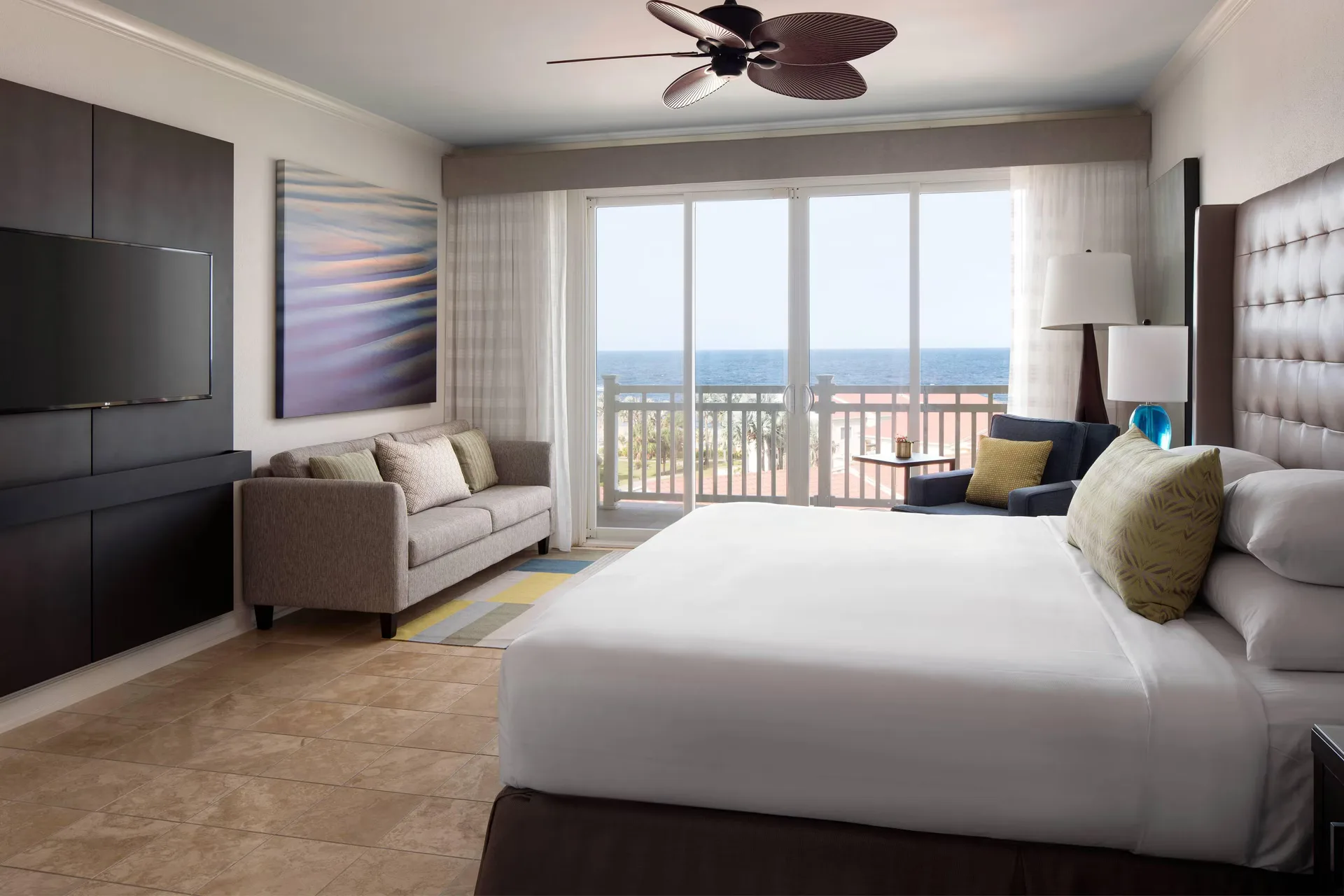 Guest room with king bed and balcony at St Kitts Marriott Beach Resort, Casino & Spa.