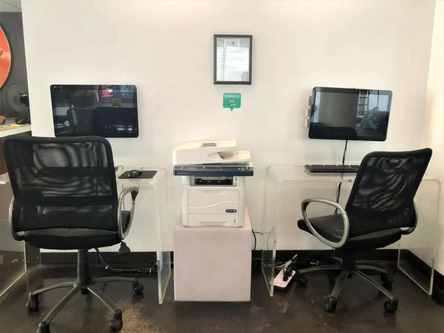 Computer stations and printer in a guest-use work area at Stay Hotel Waikiki.