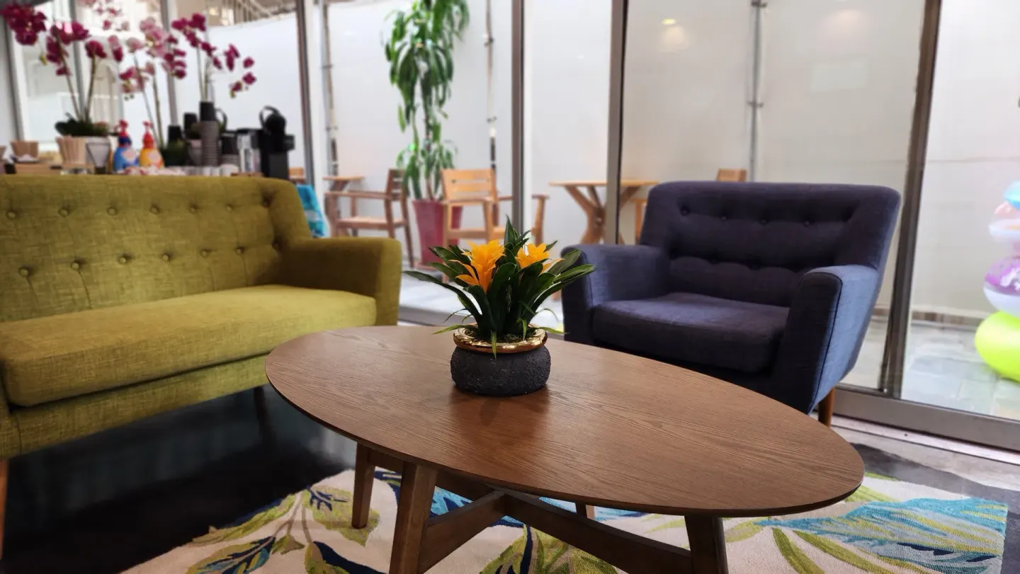 Close view of lobby coffee table and lounge chairs at Stay Hotel Waikiki.