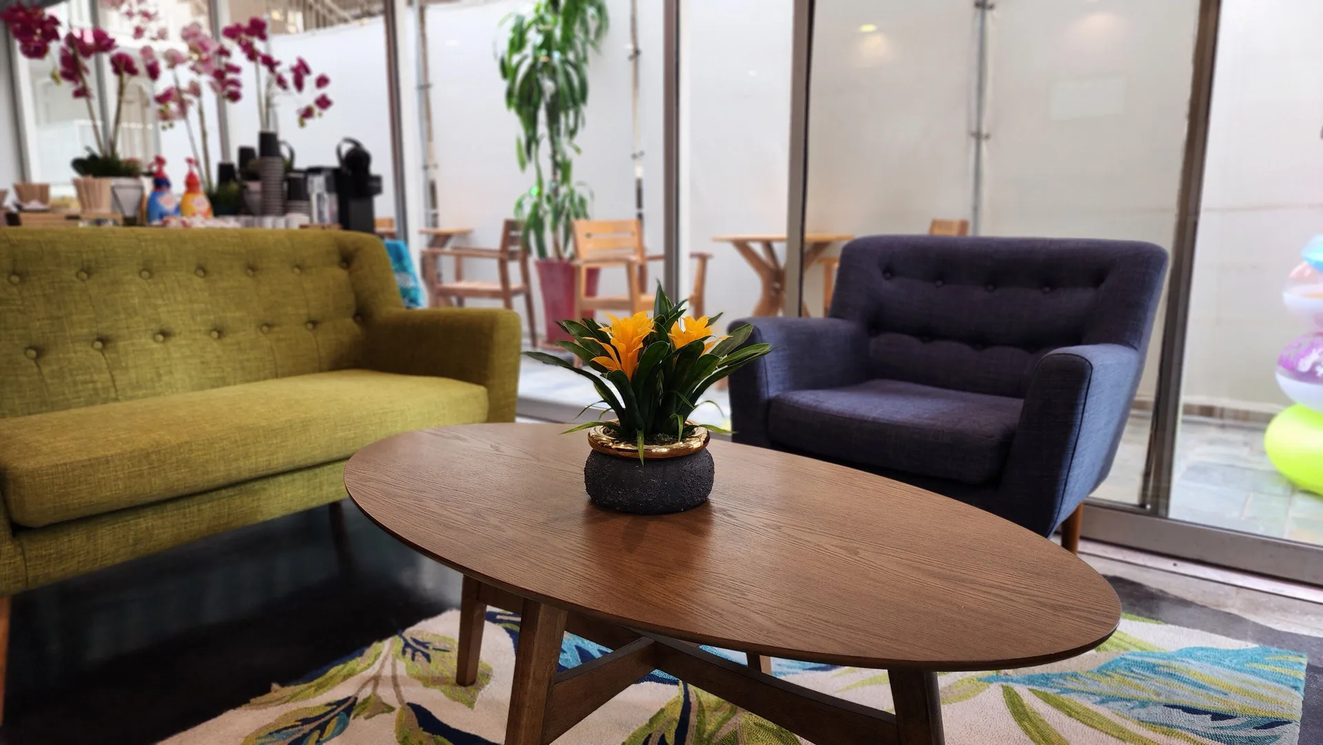 Close view of lobby coffee table and lounge chairs at Stay Hotel Waikiki.