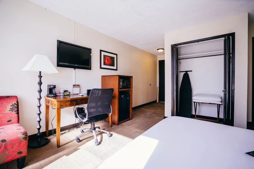 Boutique Room bed, desk, TV and open closet at Stay Hotel Waikiki.