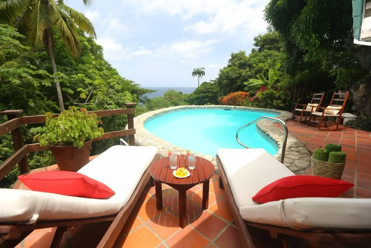 Private plunge pool with loungers and tropical foliage at Stonefield Villa Resort.