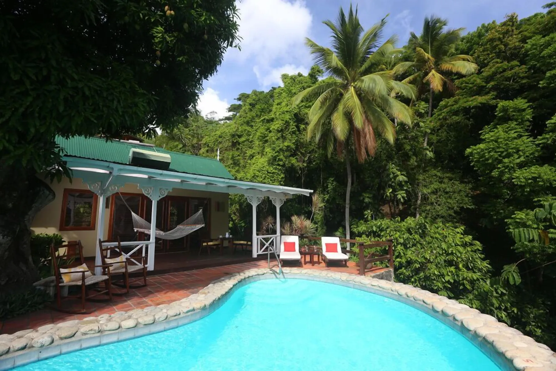 Private pool beside a villa terrace in tropical gardens at Stonefield Villa Resort.