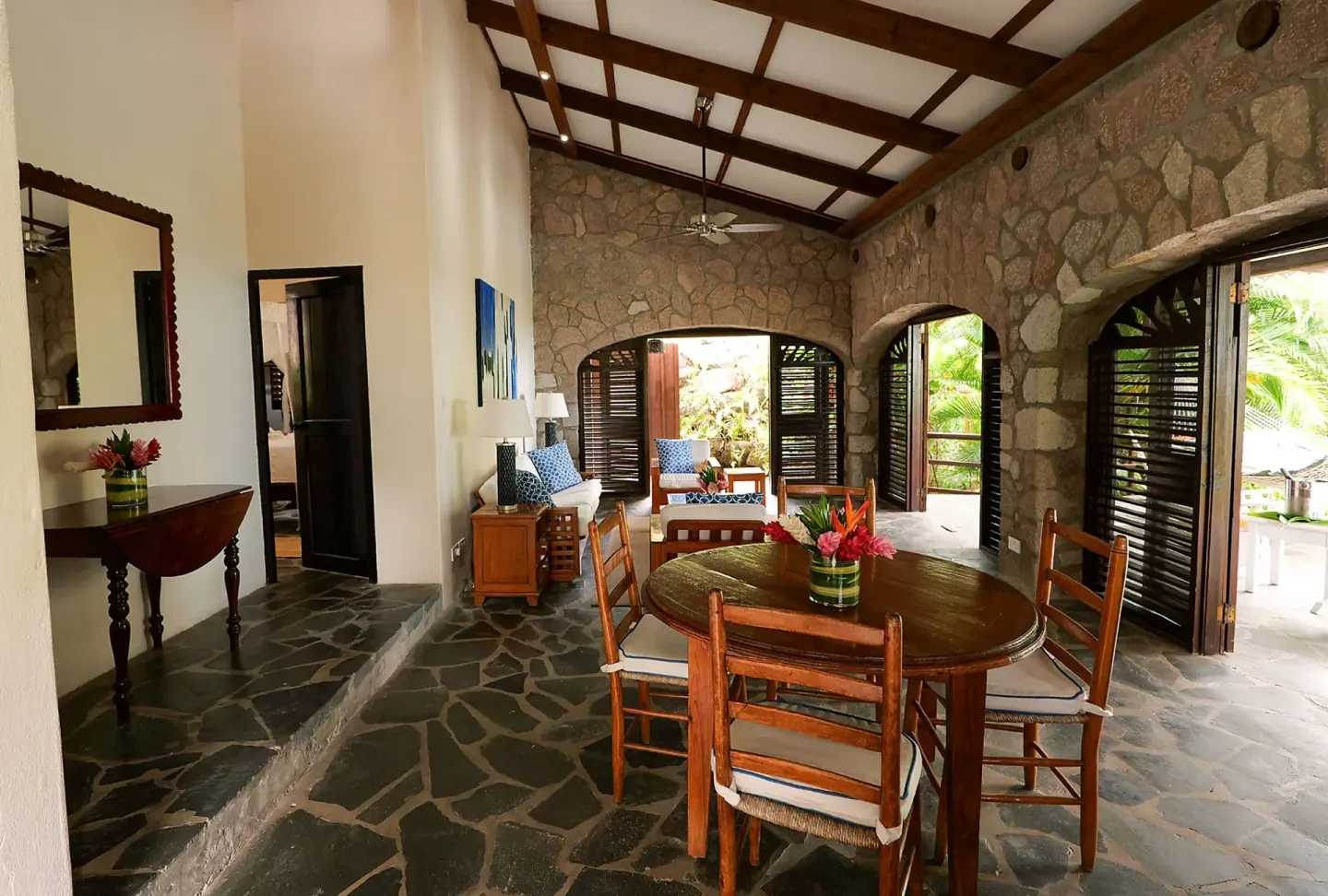 Open living and dining area in Bougainvillea Hillside View villa at Stonefield Villa Resort.
