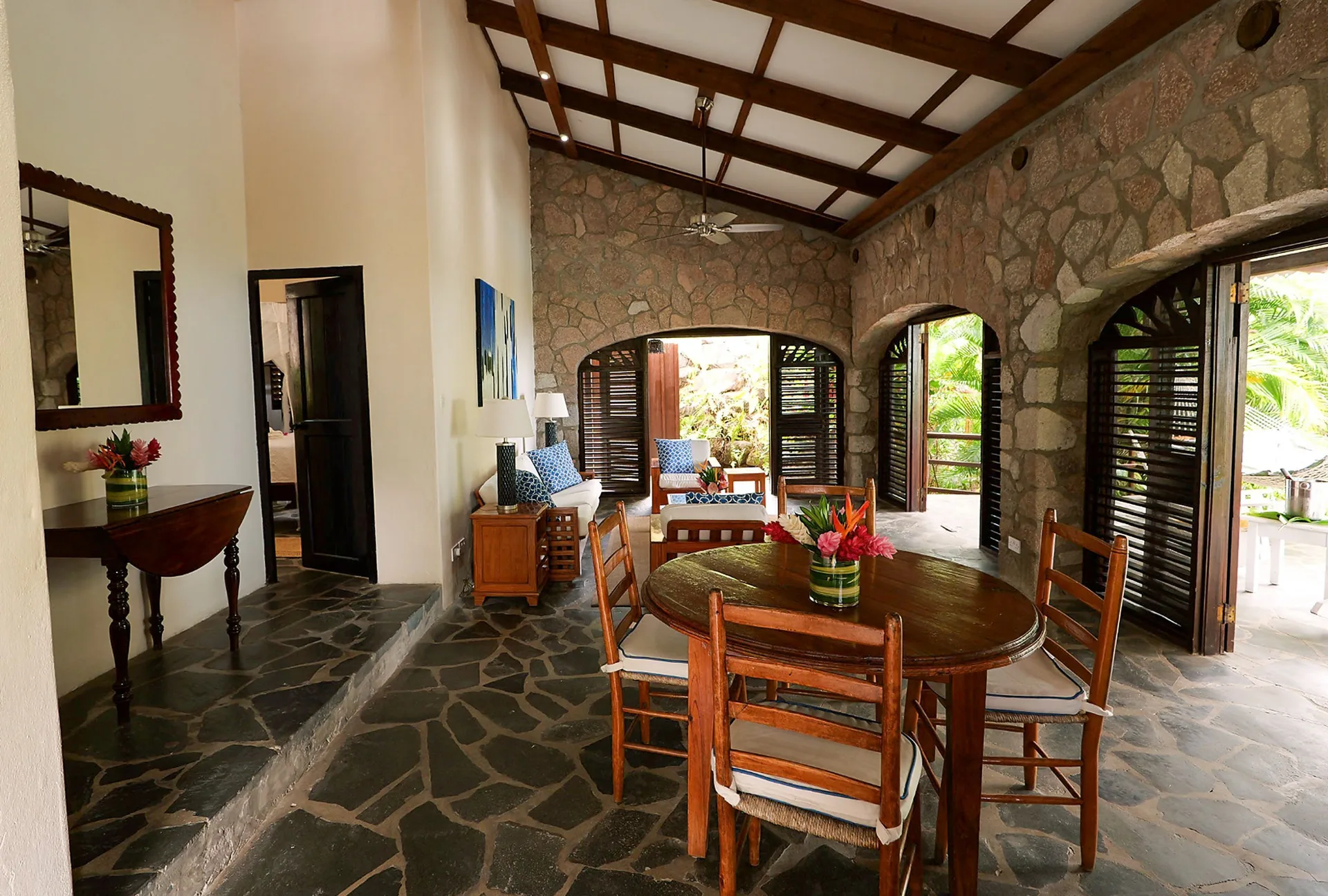 Open living and dining area in Bougainvillea Hillside View villa at Stonefield Villa Resort.