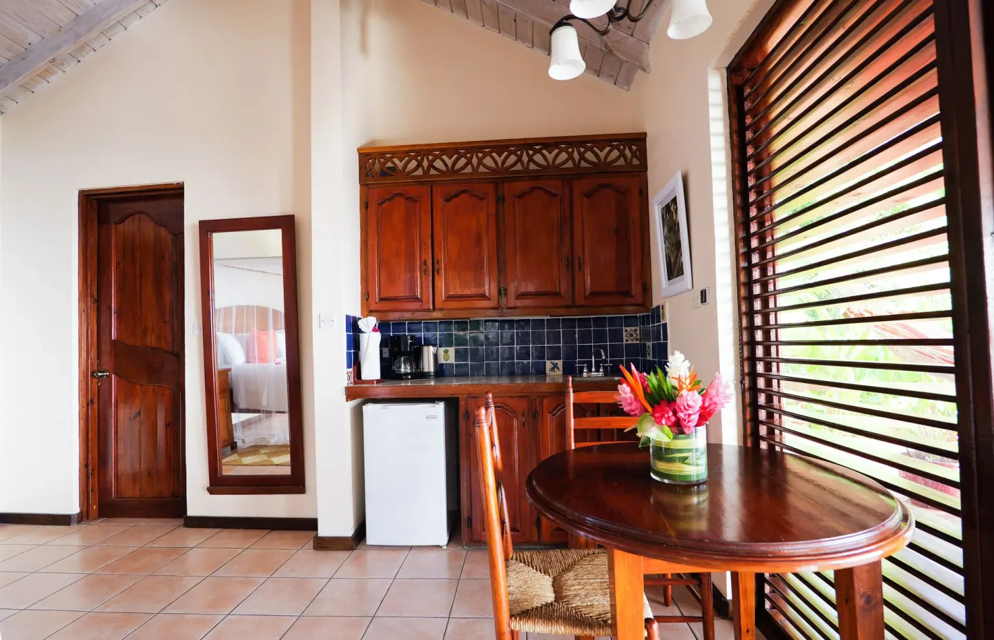 Ocean View Villa kitchenette by louvered windows at Stonefield Villa Resort.