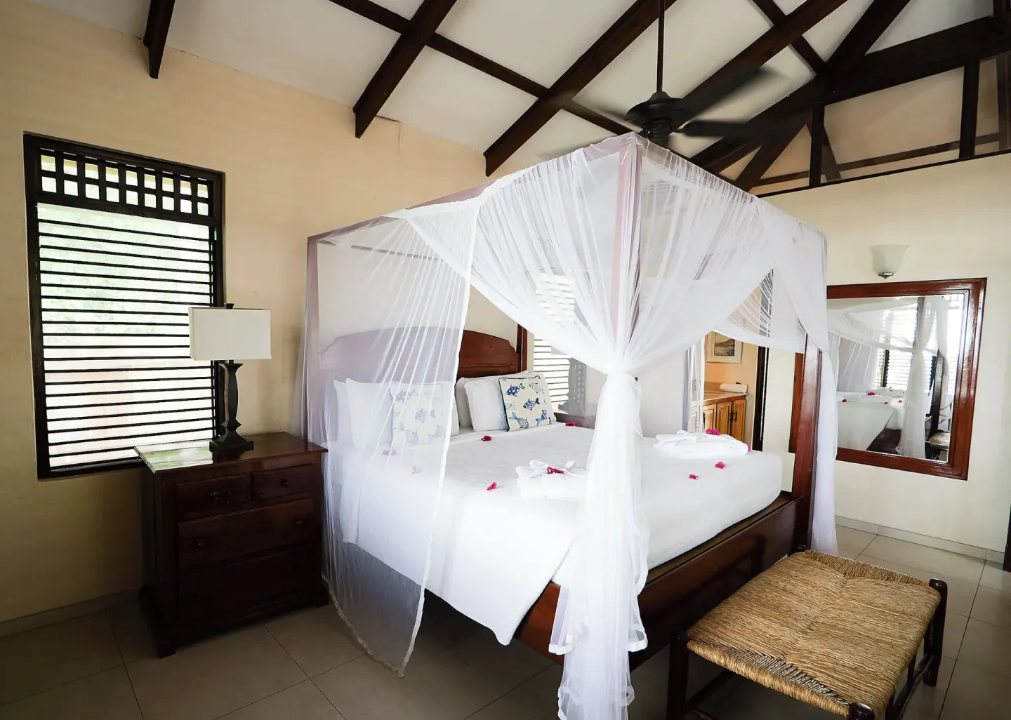 Canopy bed in a Piton Ocean View Villa guest room at Stonefield Villa Resort.