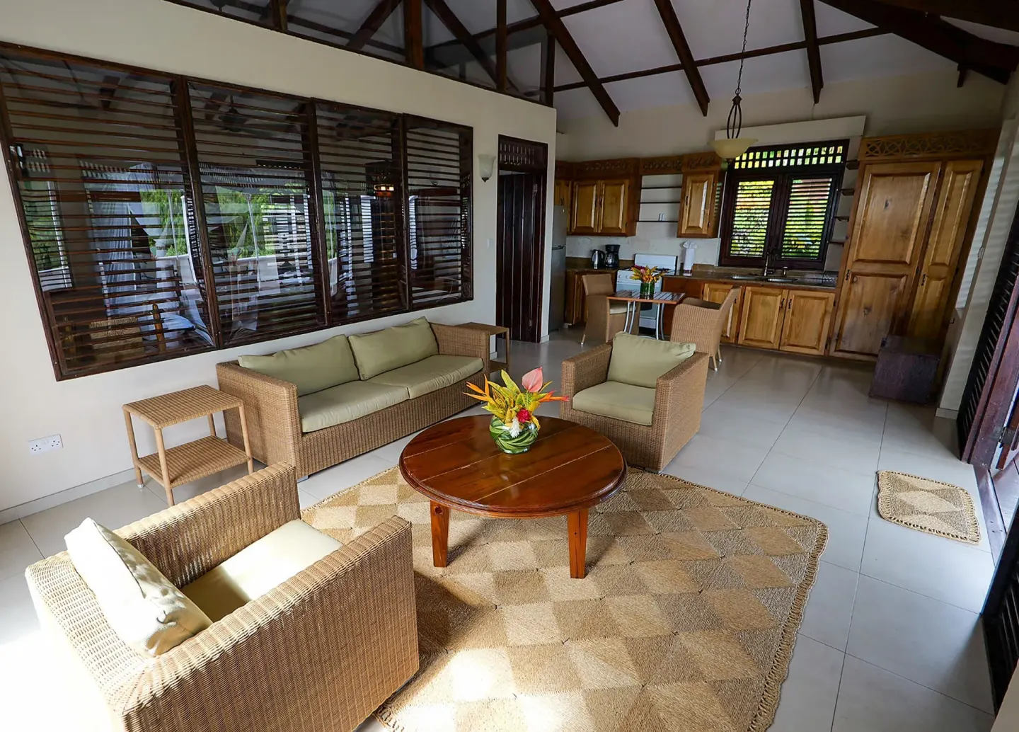 Living area and kitchen in a Piton Ocean View Villa at Stonefield Villa Resort.